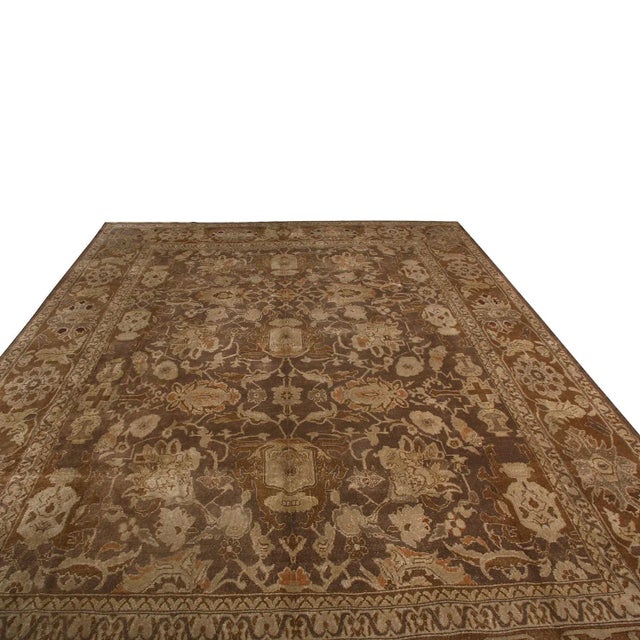 Hand-knotted in Persia originating between 1950-1960, this vintage Sultanabad wool rug enjoys pristine condition with a...