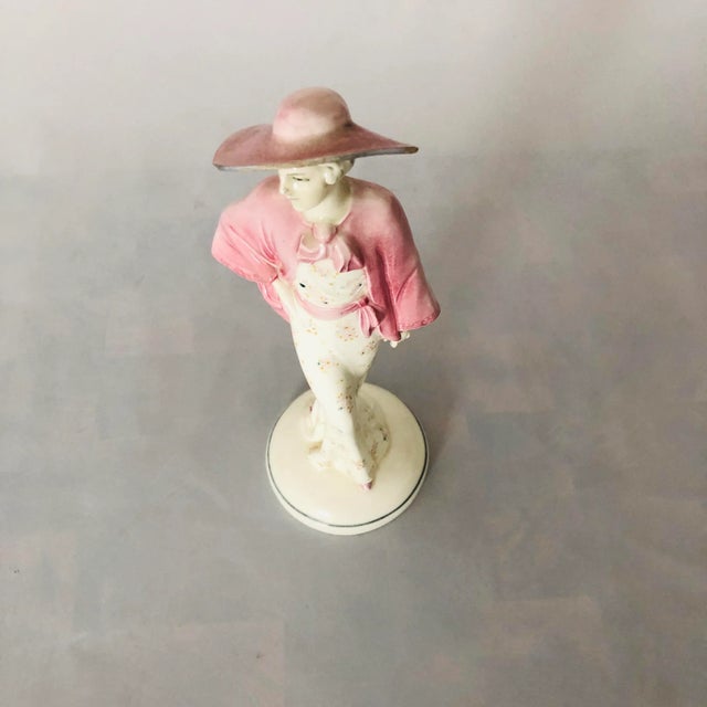 Vintage Art Deco style lady with large hat porcelain figurine, 3.25"D X 10"H , Excellent condition.