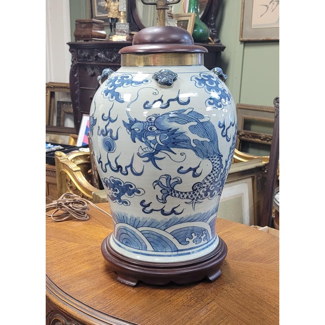 Beautiful antique 19th century Chinese vase made into a lamp. Features large porcelain vase painted with dragons mounted...