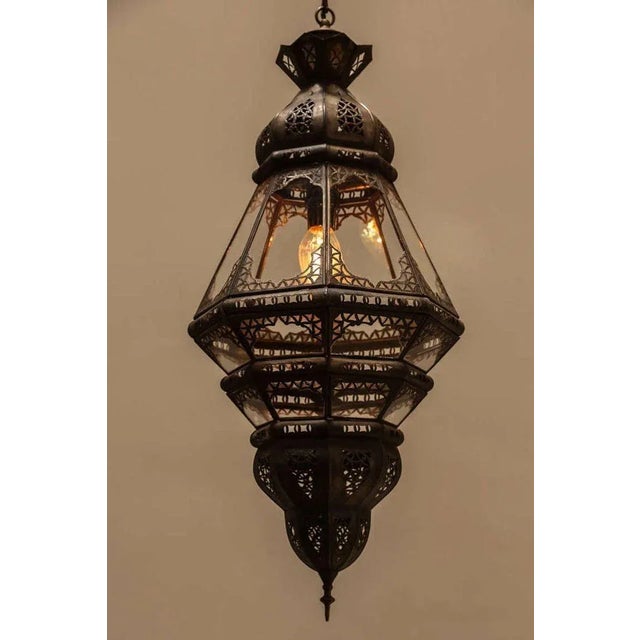 Elegant and stylish clear glass handcrafted Moroccan lantern with intricate filigree work in the Moorish style. Will add...