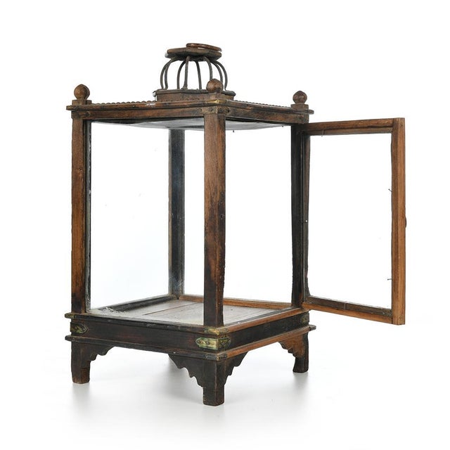 Small patinated wood central showcase. This piece is designed in the style of the selected designer and/or manufacturer