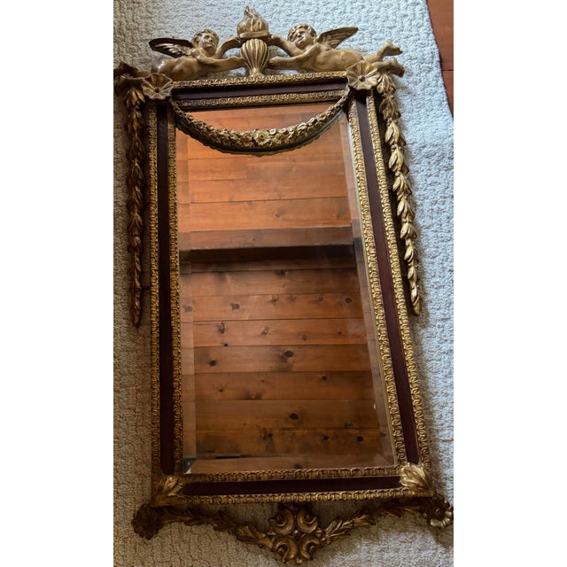 Absolutely beautiful hand carved mahogany mirror expertly crafted by and produced by the Carver’s Guild in the early 1990s...