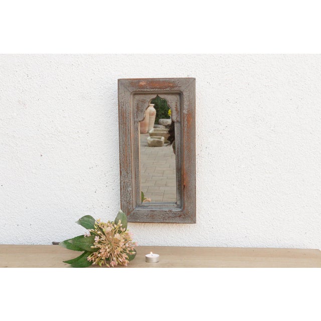 Bring the charm of old-world India into your home with this petite architectural mirror. Modeled after traditional...