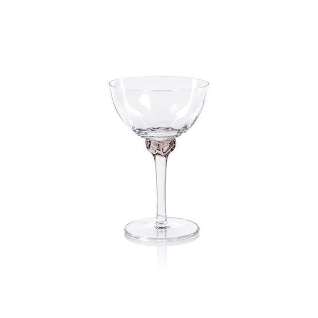 Crafted with precision and care, these glasses feature gentle grooves on the surface, adding texture and elegance to your...