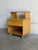 This vintage bedside chest features a distinctive step-table design with an integrated upper shelf over an open storage...
