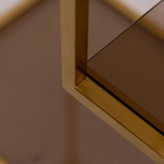 This vintage brass display cabinet features unique midcentury design, combining simple lines and an elegant way to store...