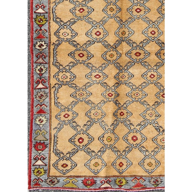 Traditional Vintage Turkish Oushak Rug With Golden Tan Field and Repeating Rosette Motif For Sale - Image 3 of 9