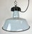 Industrial grey enamel pendant light made by Polam Wilkasy in Poland during the 1960s. White enamel inside the shade. Cast...