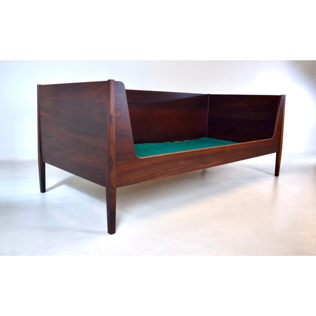 An outstanding 1960s Rosewood daybed by Kai Winding for Hundevad and Company, finished on all sides with original fitted...