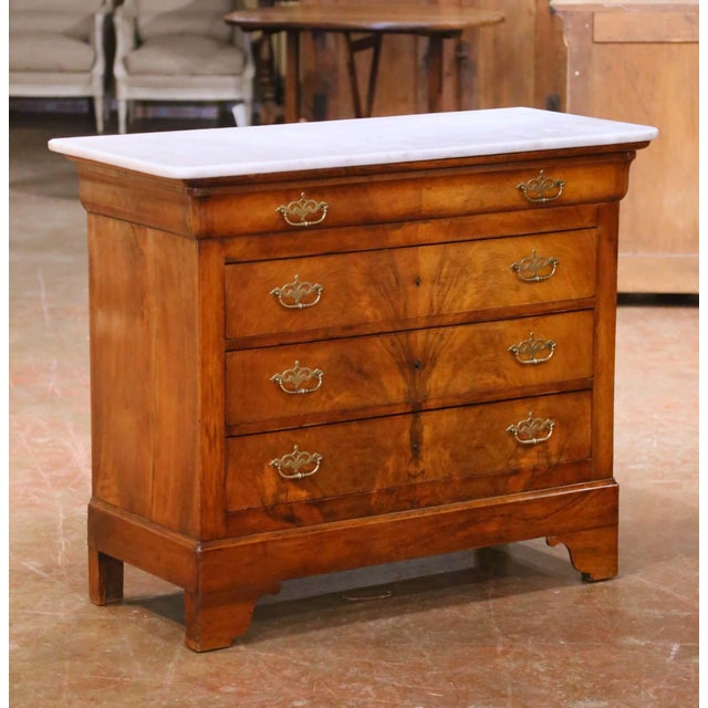 This elegant antique French commode was crafted during the Louis Philippe period, circa 1860. The piece is built of richly...