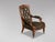 A very stylish, high-quality late 19th-century Victorian period Arts & Crafts carved walnut leather library armchair....