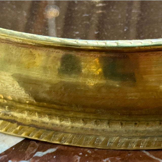 This vintage oval brass tray from 1970s Italy combines elegance and functionality with its polished brass construction,...