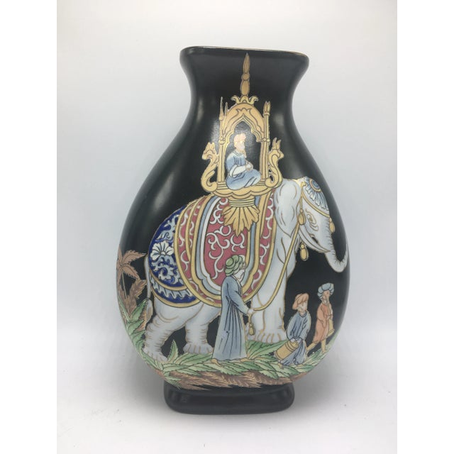 Striking in black, this chinoiserie piece will blend nicely with others for your collection