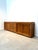 Impressive extra-long teak sideboard featuring a clean, architectural design and a beautiful warm wood grain. Crafted from...