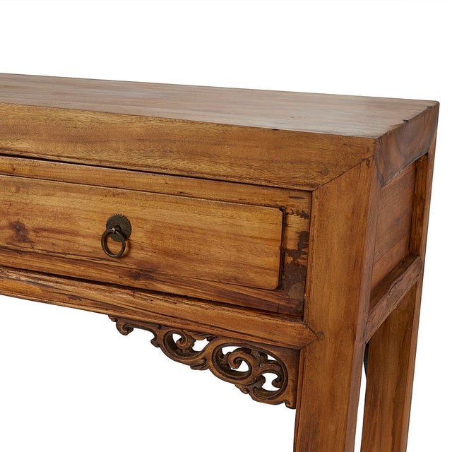 This antique Japanese elmwood console table that was handcrafted in Japan for the Chinese export market features the...