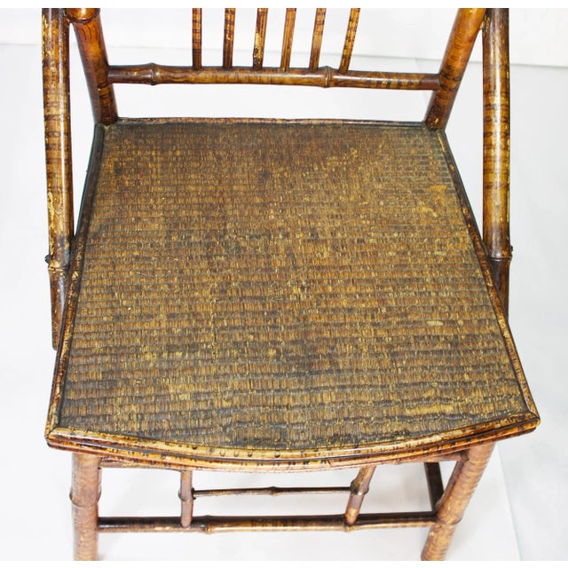 With its finely woven rattan seat and convincing faux paint & lacquer, this 1920's delicate bamboo chair is a lovely...