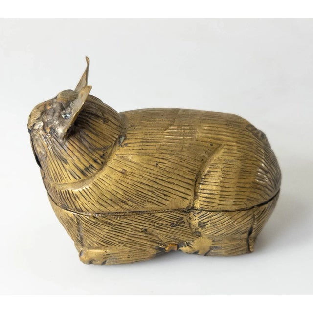 We are selling this South East Asian hand hammered repousse brass betel nut or leaf box in the form of an animal....