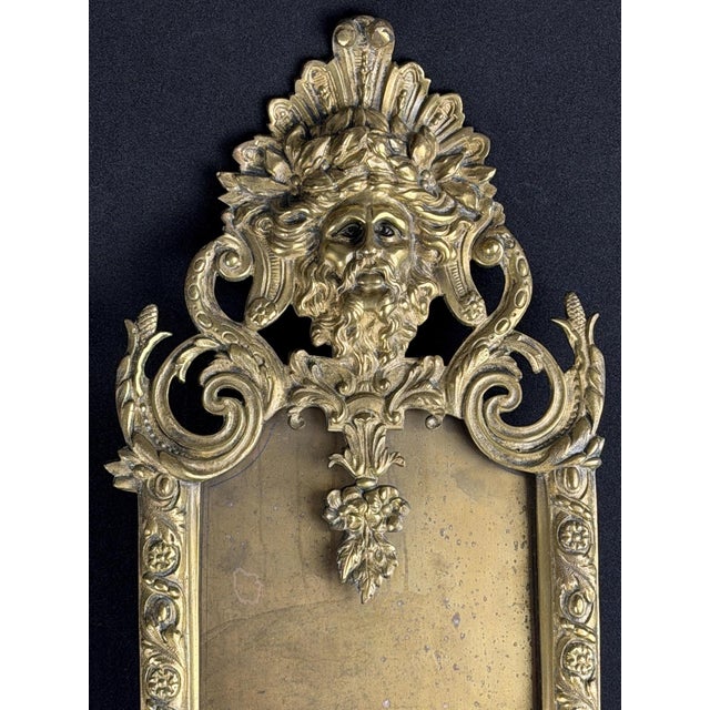 A rare and richly detailed 19th-century cast bronze/brass mirror frame, crafted in France or Northern Italy around...