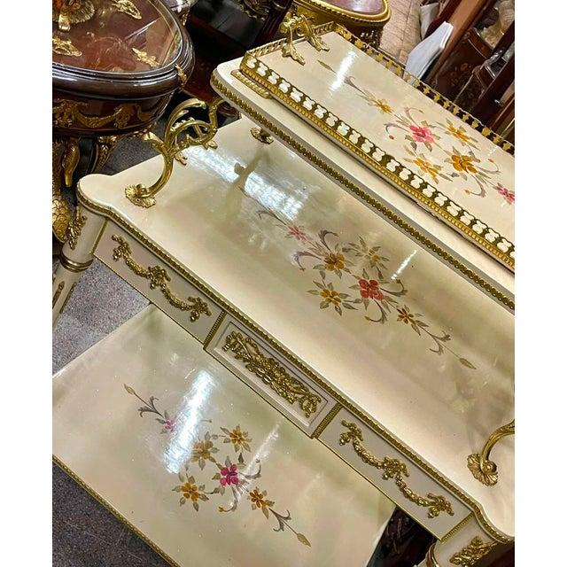Add a refined European touch to your interior with this French-style white serving table, featuring a beautifully finished...