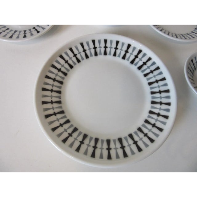A sixty piece set or 10 place settings of Mid Century china with a gray and black pattern designed by Paul McCobb ....