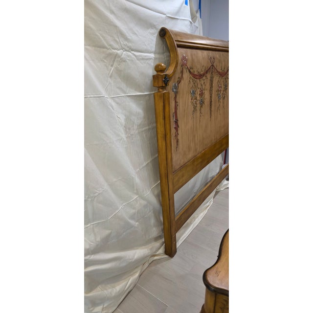 Headboard & Pair of French Provincial Style Nightstands by Butler Specialty Company. Each has hand painted floral decor....