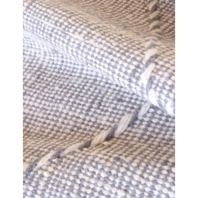 Introduce elegance into your space with our Small Moroccan Kilim Wool Rug. Measuring 6.9 x 2.85 ft, it features a gray...