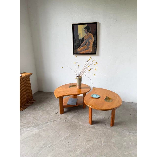 Set of two solid elm coffee tables in a teardrop shape. inspired by the work of pierre chapo, we particularly love their...