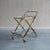 This 1950s Italian bar trolley exemplifies the elegant, dynamic lines characteristic of mid-century Italian design....