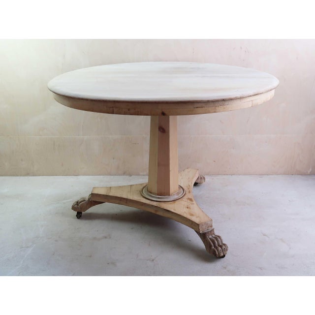 Fabulous small round table. Made from bleached tropical hardwood and pine with lions paw feet. On castors. I particularly...