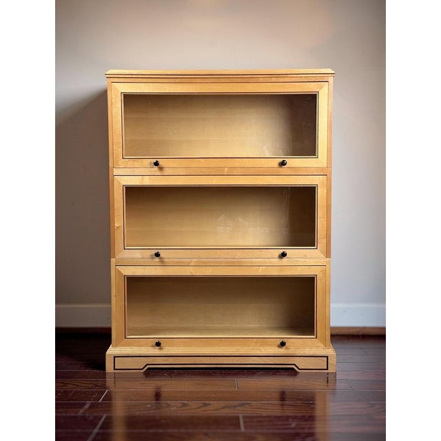 This handsome vintage barrister bookcase combines the clean practicality of traditional sectional library furniture with a...