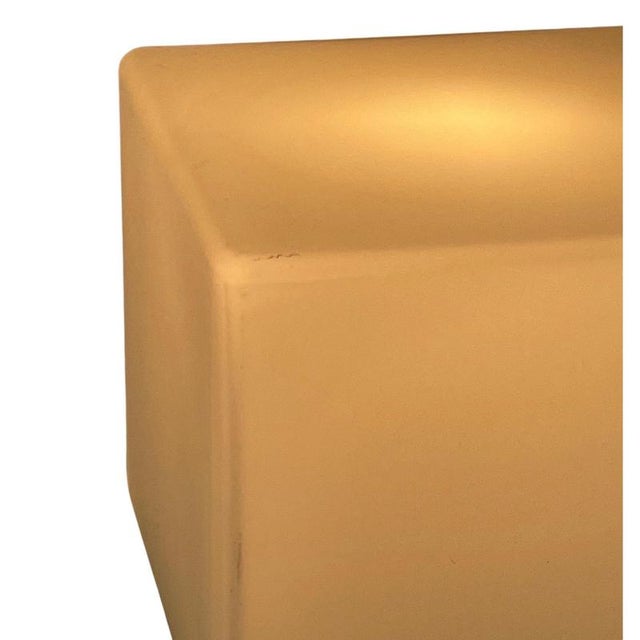 Contemporary design table lamp made by TRE Italy. Made from a metal base that supports a frosted glass square shade. The...