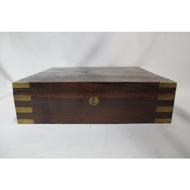 Mid Victorian carved Rosewood box with hinged lid and lock. Hand polished finish with brass hardware. Completely open...