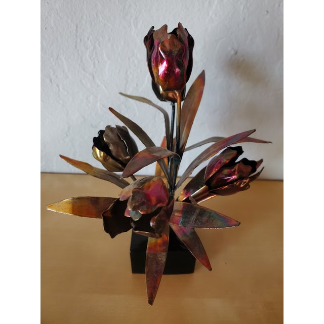 Beautiful pair of detailed, metalwork florals set on black resin bases. Unsure if the metal is brass or bronze but it is a...