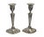 Pair of STERLING silver weighted candle holders on a sweeping, oval-cloud-shaped base, framed and profiled segments pulled...