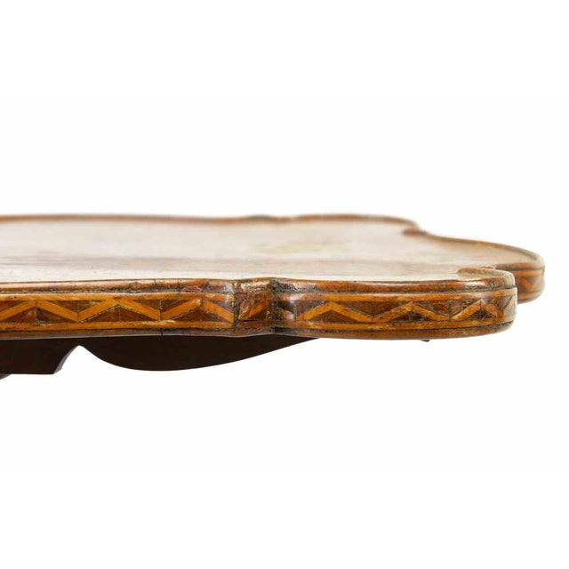 Vintage coffee table is a design item realized in 19th century Austria. Elegant little sail table in maple wood with...