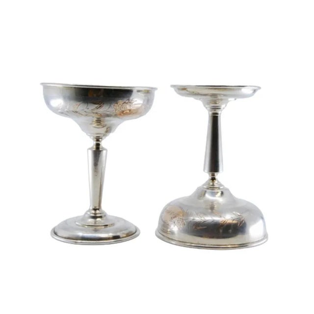 Silver Champagne Glasses with Engraved Floral Motifs and Gold Interior, in Very Good conditions. Designed 1890 to 1919...