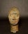 A finely cast bronze portrait head in the style of the ancient Yoruba kingdom of Ife, Nigeria. This dignified bust...