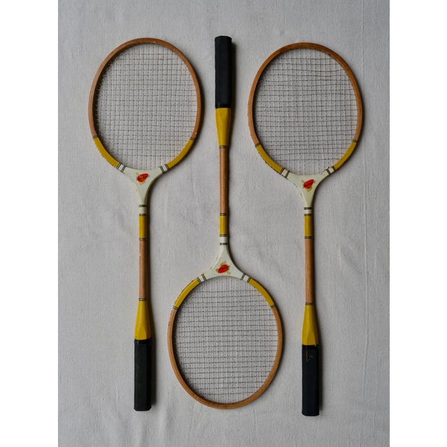 This set of three vintage Dumont badminton racquets was manufactured in Japan during the mid-20th century, when Japanese...
