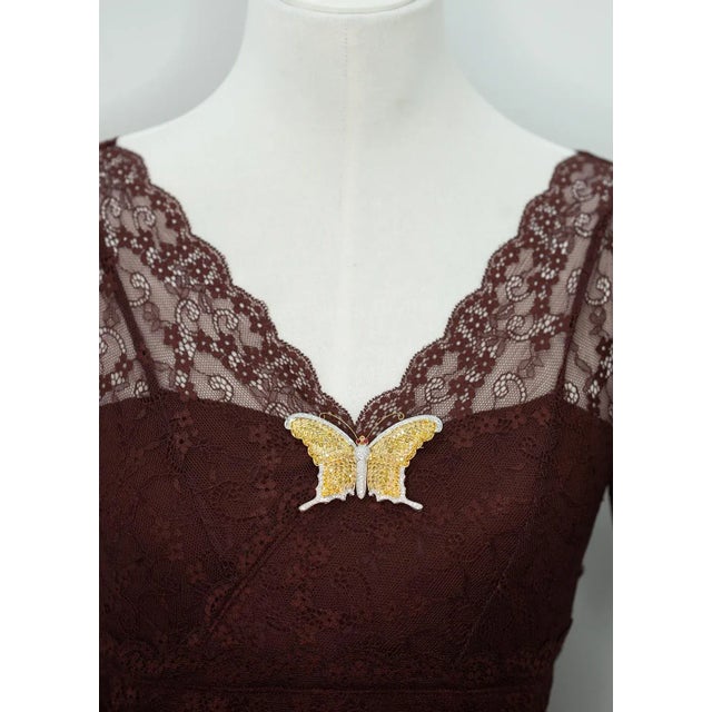 An elegant butterfly brooch crafted in 18K yellow and white gold set with approximately 11.0 carats of pavé-set brilliant-...