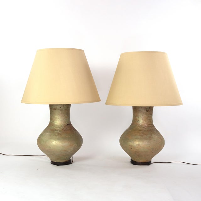 Pair of large scale glazed concrete ovid form table lamps on wooden bases, American circa 1978 height: 36 in. 91.5 cm.,...