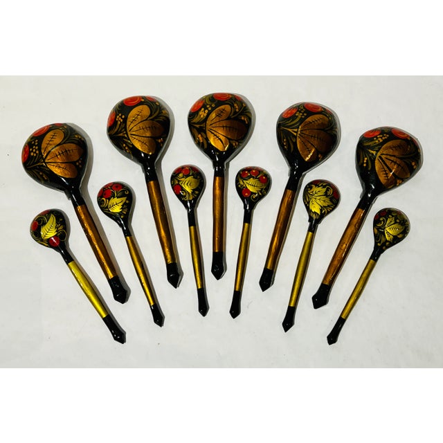 Vintage serving set of 11 Khokhloma hand painted wood lacquerware spoons, made in the USSR. The set includes: 5 larger...