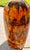 Brutalist Fat Lava table lamp with a two-tiered striped shade, c. 1970s. A vibrant orange drip glaze with brown and golden...