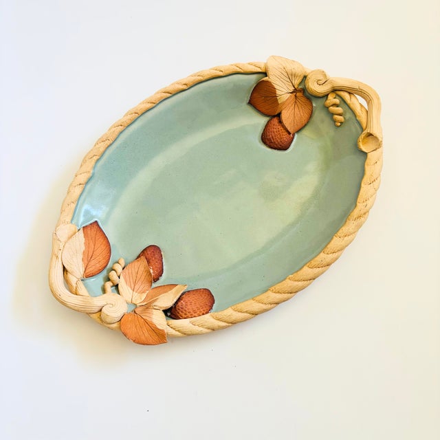 A vintage art pottery tray by California ceramicist, Brigitte Haag. Lovely detailing with a twisted rope rim and a highly...