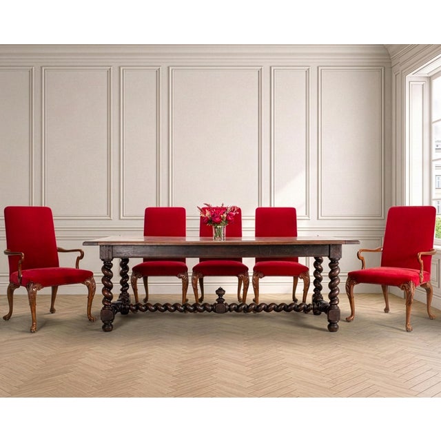 A handsome 19th century French Provincial Louis XVIII-style farmhouse dining table crafted from solid oak with beautifully...