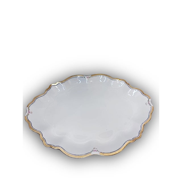 Elegant antique porcelain serving platter by M & Z Austria (Moritz Zdekauer), produced circa 1890–1918. This refined piece...