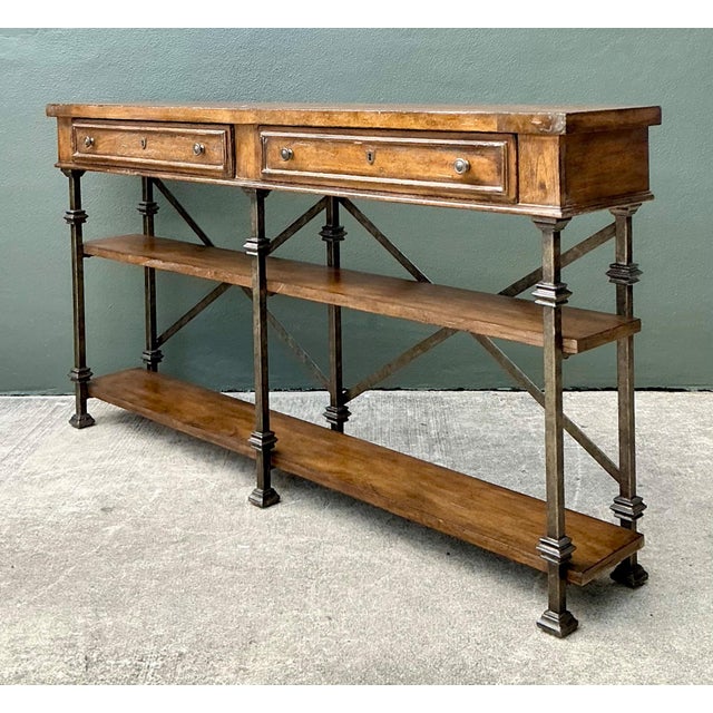 This vintage console table by Stanley Furniture exemplifies a refined balance of industrial strength and traditional...