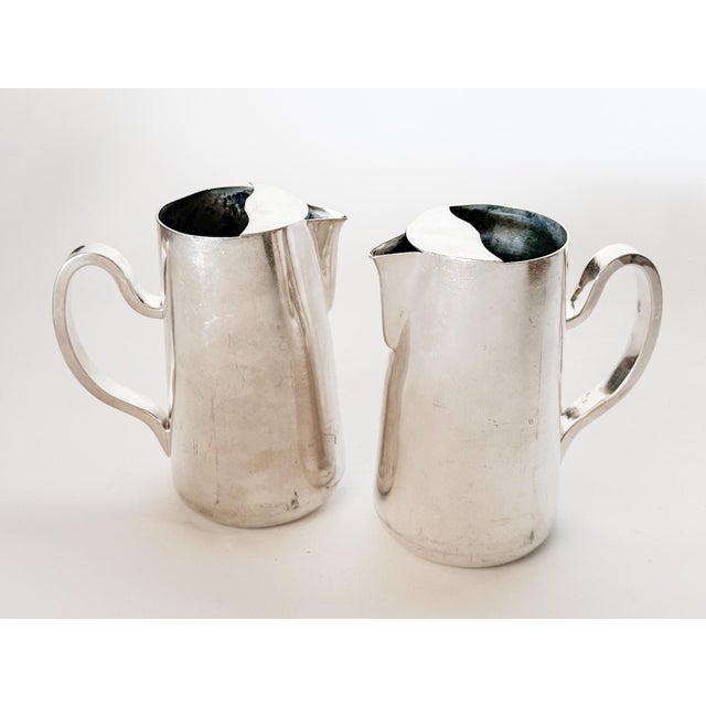 This gorgeous pair of vintage hotel silver plate water pitchers made by D.W. Haber & Son NY is the same pattern used at...