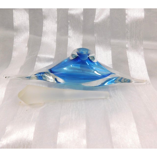 This is a turquoise blue cased in clear art glass perfume bottle. Surprisingly, it is not marked or signed. The blue...
