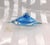 This is a turquoise blue cased in clear art glass perfume bottle. Surprisingly, it is not marked or signed. The blue...