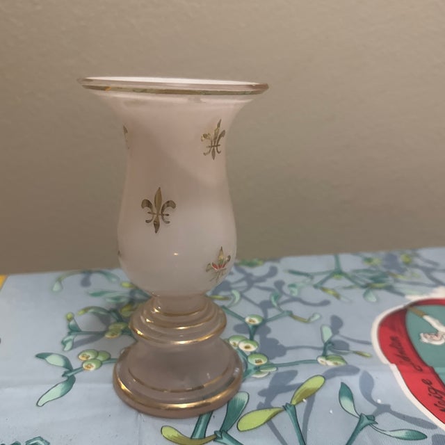 This piece is a vintage opaline glass hurricane vase, likely from the mid-20th century. It features a classic frosted...